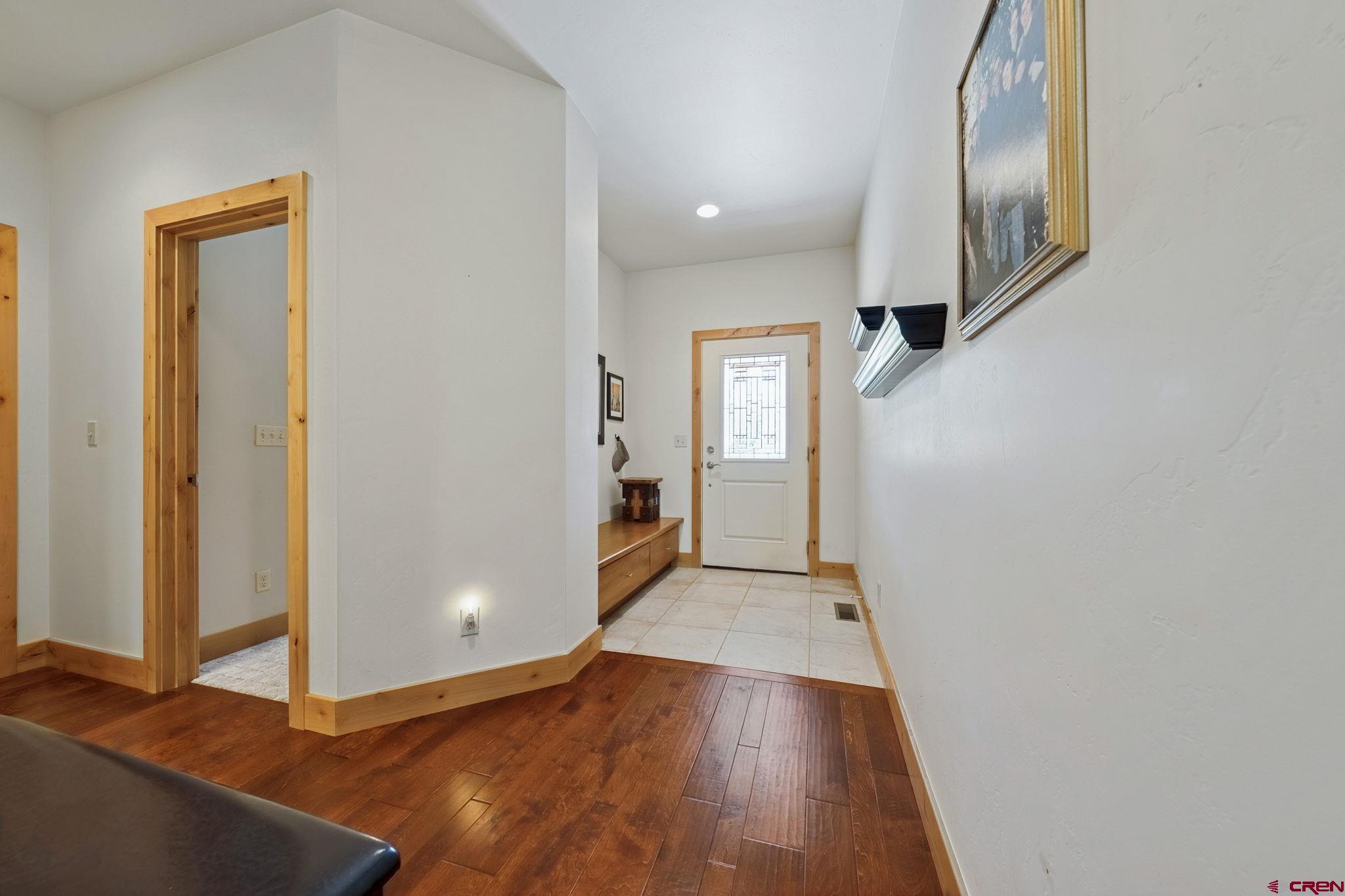 67 Mountain Stream Court Durango, CO 81301 - Photo 12 of 35 wooden floor in an empty room with a window