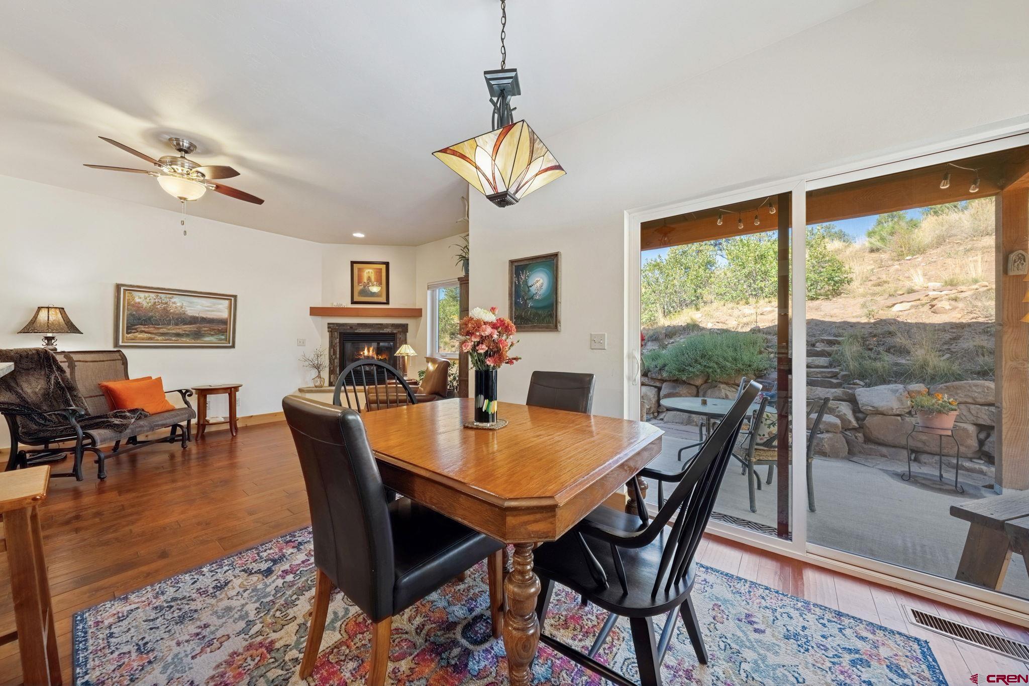 67 Mountain Stream Court Durango, CO 81301 - Photo 14 of 35 a view of a dining room with furniture window and wooden floor