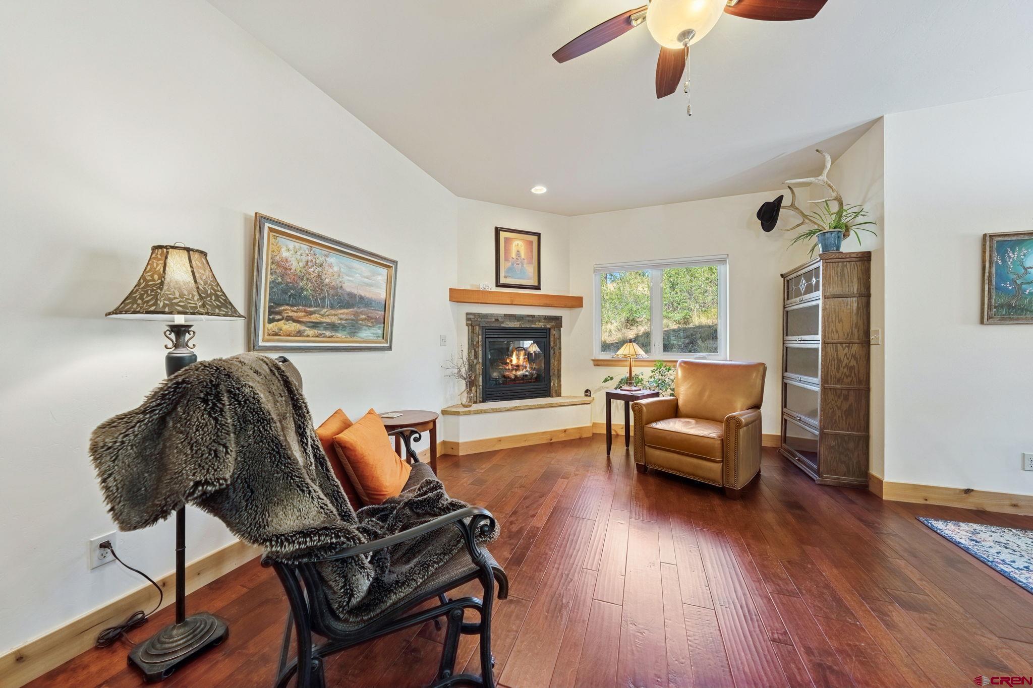 67 Mountain Stream Court Durango, CO 81301 - Photo 17 of 35 a living room with furniture and a wooden floor
