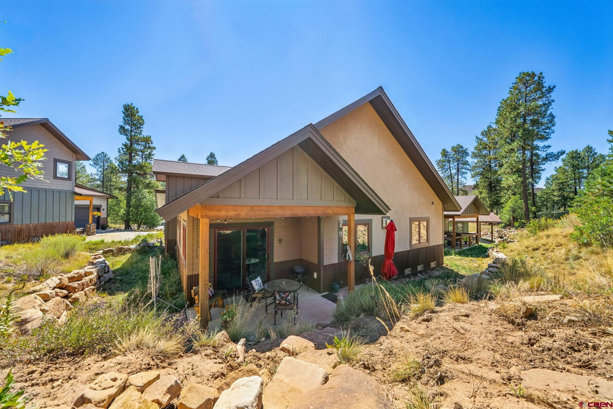67 Mountain Stream Court Durango, CO 81301 - Photo 21 of 35 a view of house with a yard and garden