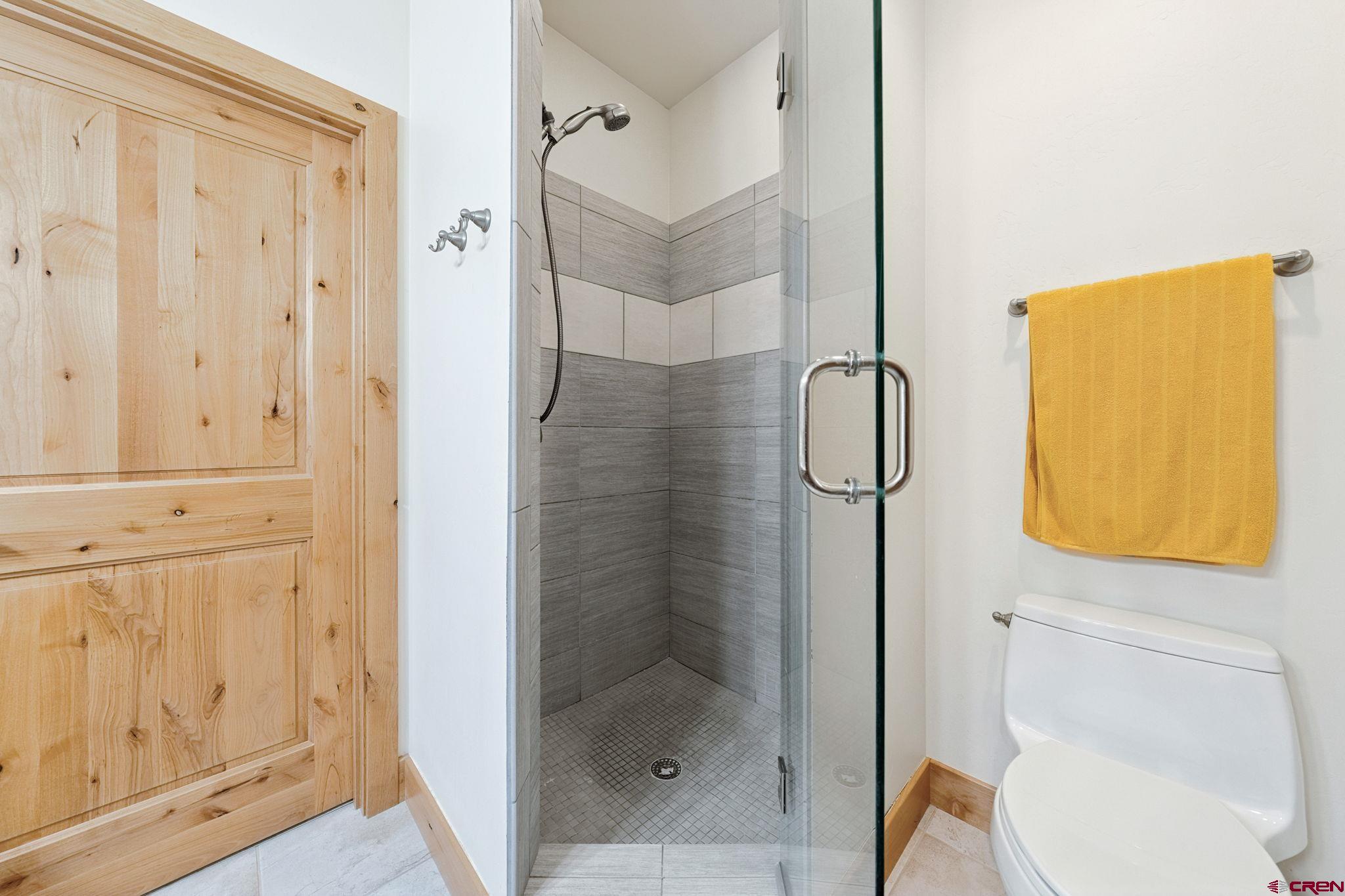 67 Mountain Stream Court Durango, CO 81301 - Photo 27 of 35 a bathroom with a shower and toilet