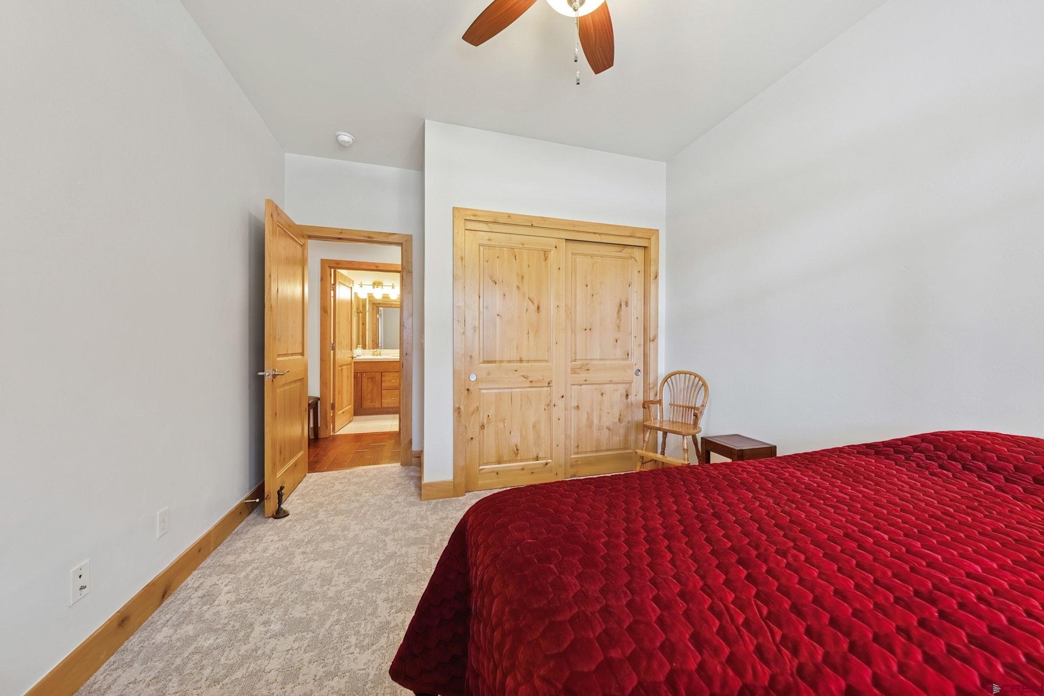 67 Mountain Stream Court Durango, CO 81301 - Photo 29 of 35 a bedroom with a bed and window