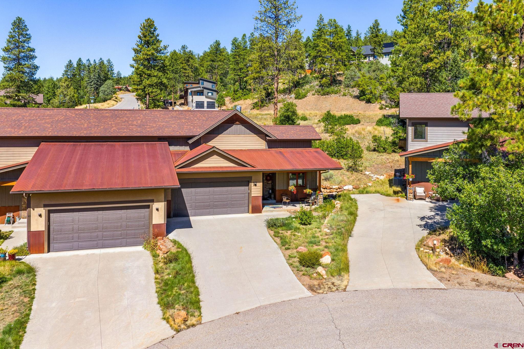 67 Mountain Stream Court Durango, CO 81301 - Photo 3 of 35 a front view of a house with garden