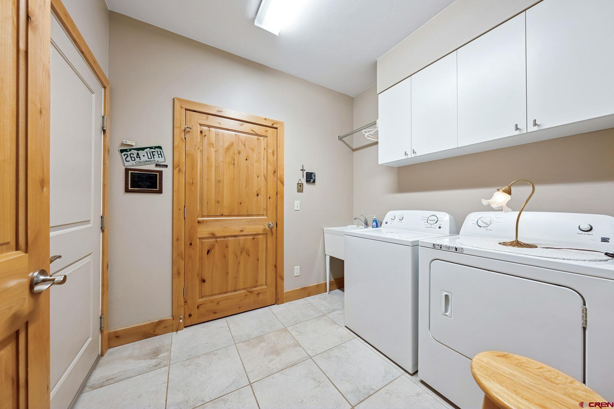 67 Mountain Stream Court Durango, CO 81301 - Photo 33 of 35 a utility room with dryer and washer