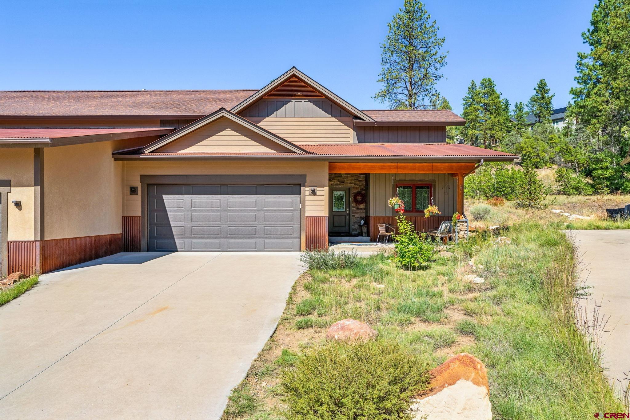 67 Mountain Stream Court Durango, CO 81301 - Photo 4 of 35 a front view of a house with garden