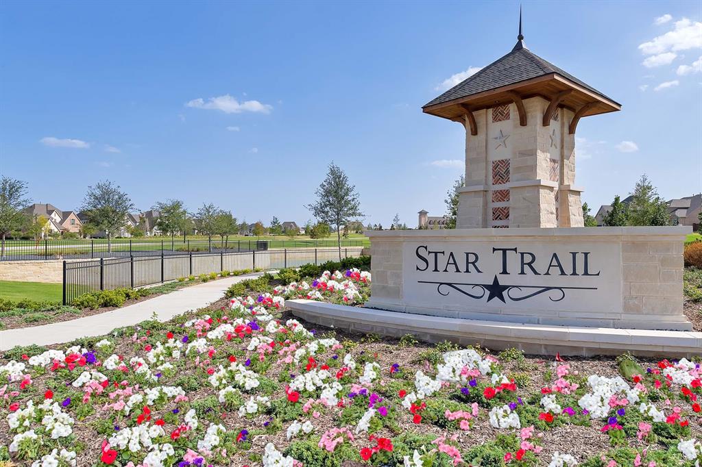 2781 Compton Court Prosper, TX 75078 - Photo 2 of 3 a sign that is in front of flowers