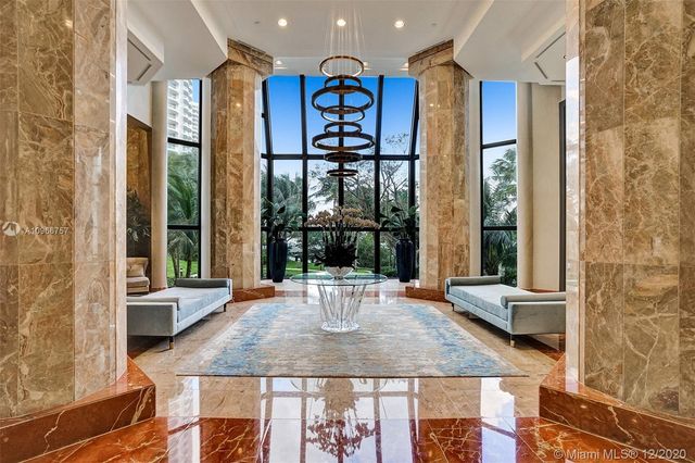 a view of a lake with tall buildings