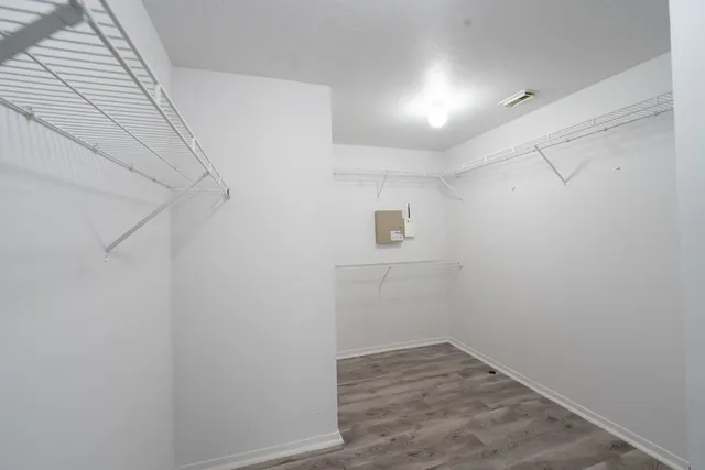 a view of a hallway with closet