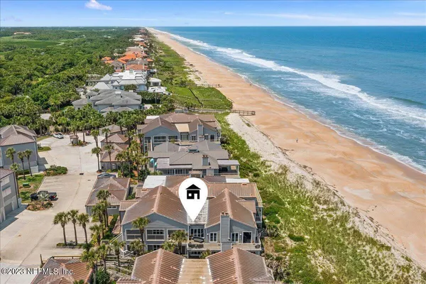 a aerial view of a house with outdoor space