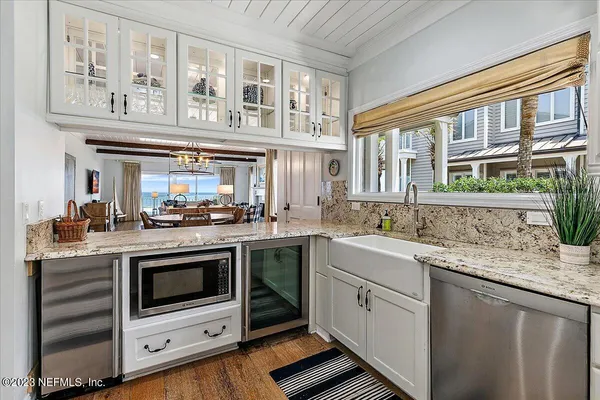 a kitchen with stainless steel appliances granite countertop a stove and a sink