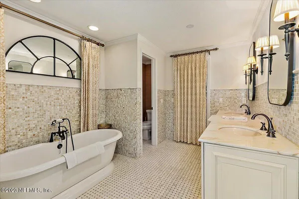 a bathroom with a sink a bathtub and a shower