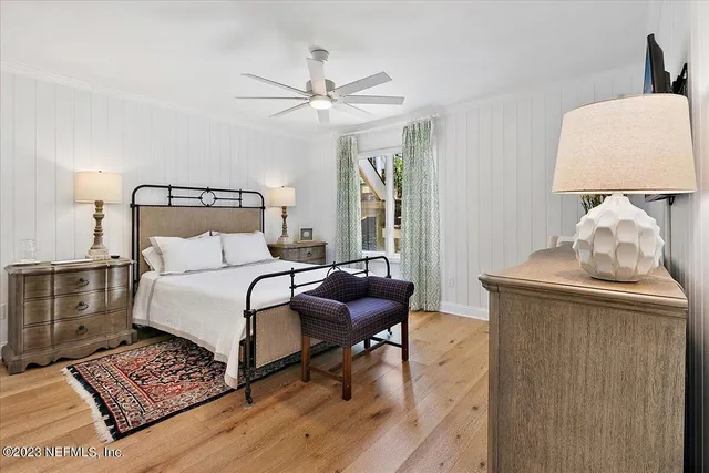 a bedroom with furniture and a window