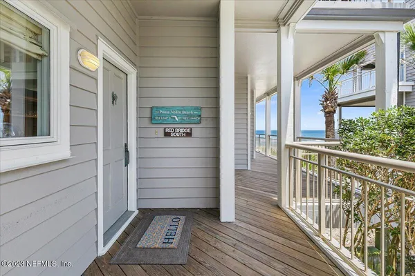 a view of a balcony with wooden floor