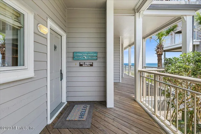 a view of a balcony with wooden floor