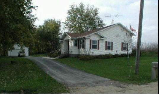 9478 North Excelsior Road Lena, IL 61048 - Photo 1 of 9 a view of a yard in front of house