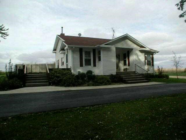 9478 North Excelsior Road Lena, IL 61048 - Photo 6 of 9 a front view of a house with a yard