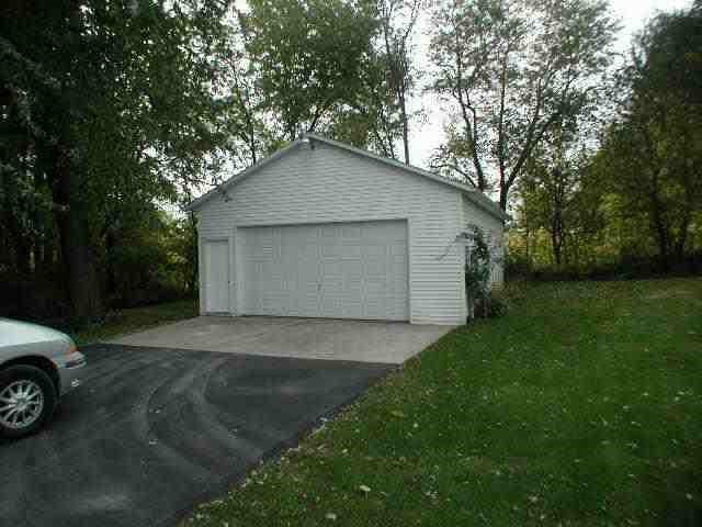 9478 North Excelsior Road Lena, IL 61048 - Photo 7 of 9 a view of backyard of garage and trees