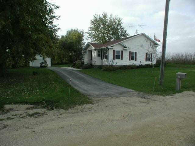 9478 North Excelsior Road Lena, IL 61048 - Photo 9 of 9 a view of a white house with a yard
