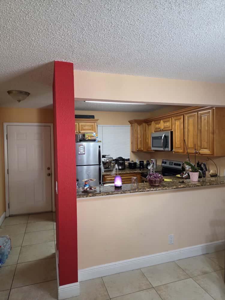 a kitchen with stainless steel appliances granite countertop a sink and cabinets