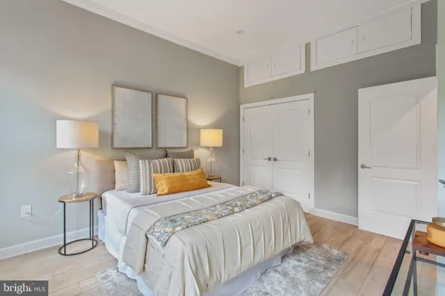 a bedroom with a bed and a table