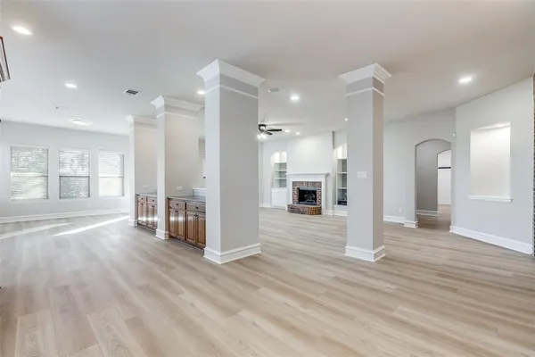 a large kitchen with cabinets a sink and appliances