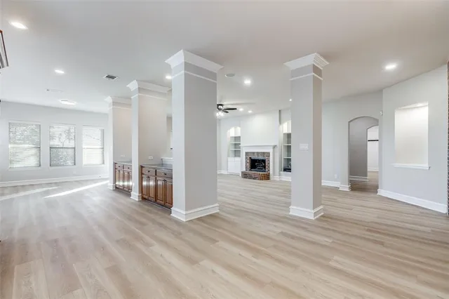 a large kitchen with cabinets a sink and appliances