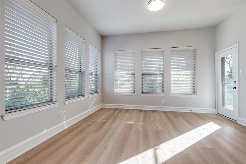 4009 Muscovy Drive McKinney, TX 75072 - Photo 13 of 31 a view of an empty room with wooden floor and a window