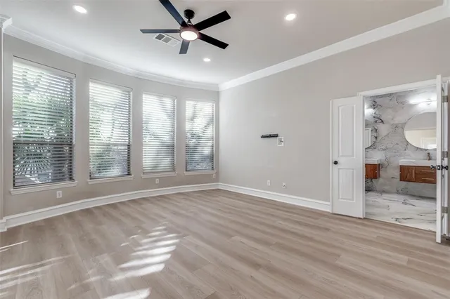 a spacious bathroom with a granite countertop sink and a mirror