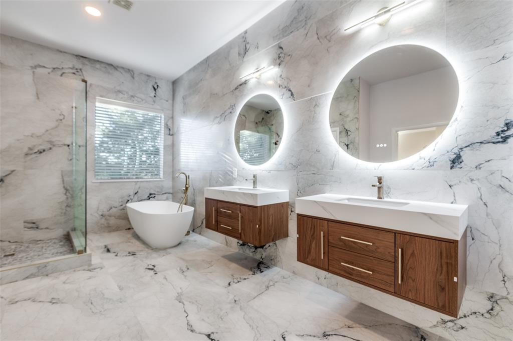 4009 Muscovy Drive McKinney, TX 75072 - Photo 18 of 31 a spacious bathroom with a granite countertop sink and a mirror