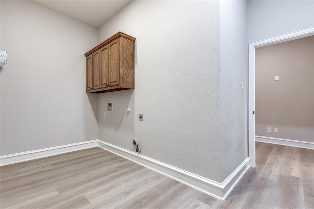 4009 Muscovy Drive McKinney, TX 75072 - Photo 22 of 31 a view of empty room with wooden floor