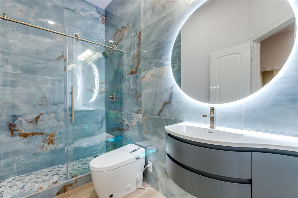 4009 Muscovy Drive McKinney, TX 75072 - Photo 23 of 31 a bathroom with a sink toilet and shower