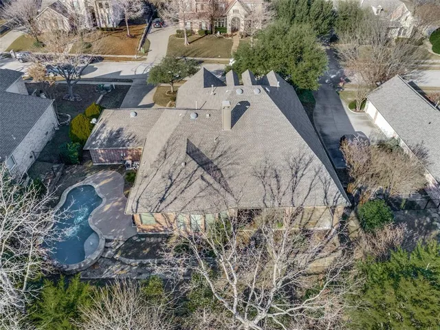 an aerial view of a house with outdoor space