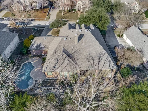 an aerial view of a house with outdoor space