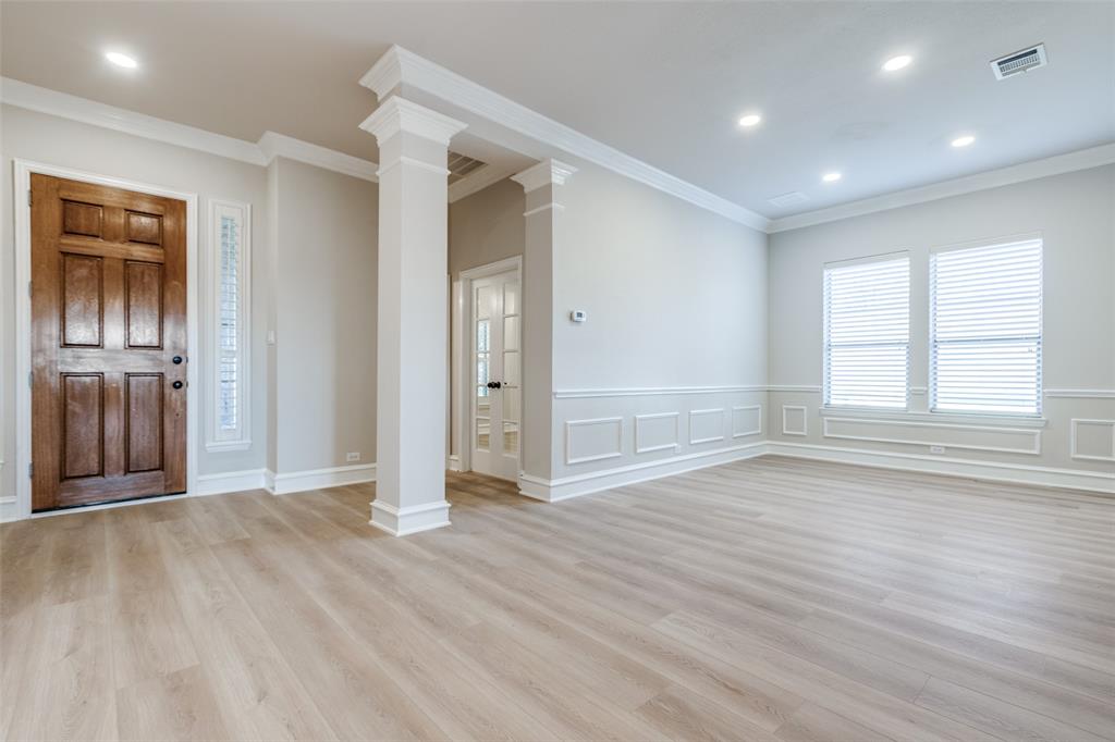 4009 Muscovy Drive McKinney, TX 75072 - Photo 5 of 31 an empty room with wooden floor and windows
