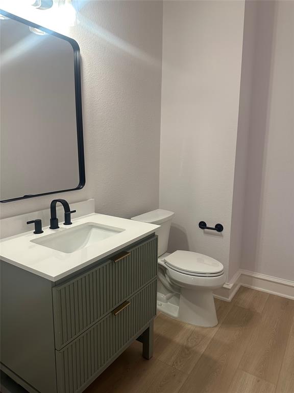 4009 Muscovy Drive McKinney, TX 75072 - Photo 7 of 31 a bathroom with a toilet sink and mirror