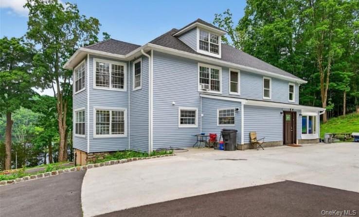 556 Lakes Road Monroe, NY 10950 - Photo 3 of 22 Back of house featuring roof with shingles