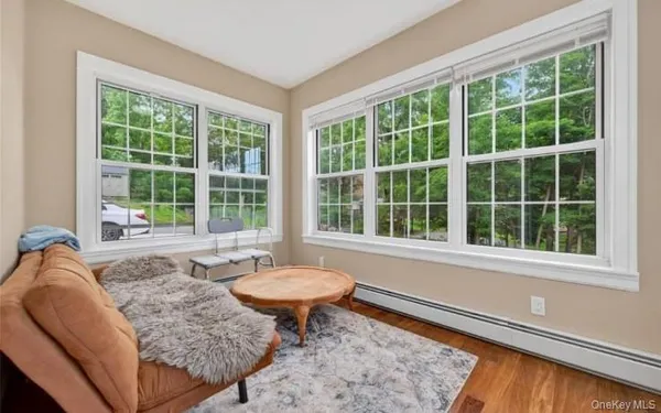 a living room filled with furniture and a window