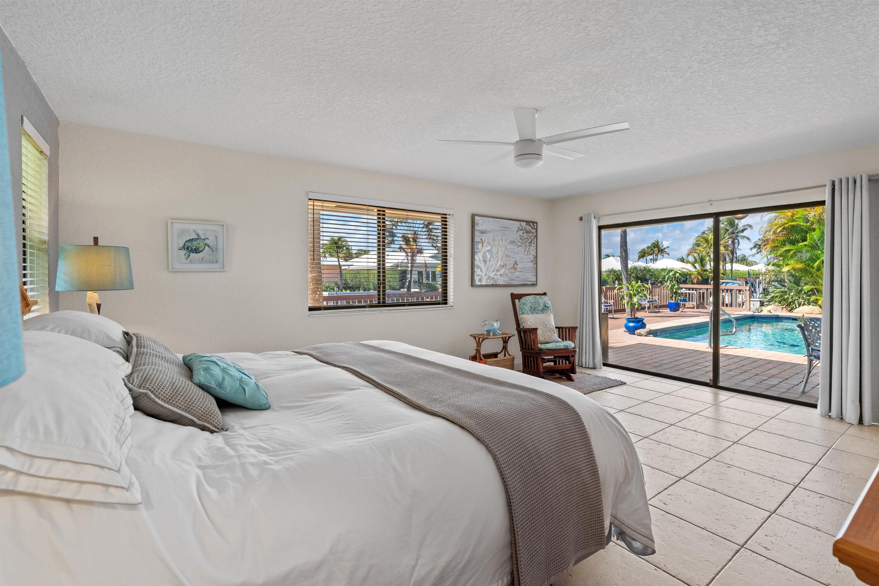 1223 Pepperridge Terrace Boca Raton, FL 33486 - Photo 16 of 34 a bedroom with a large bed and a large window