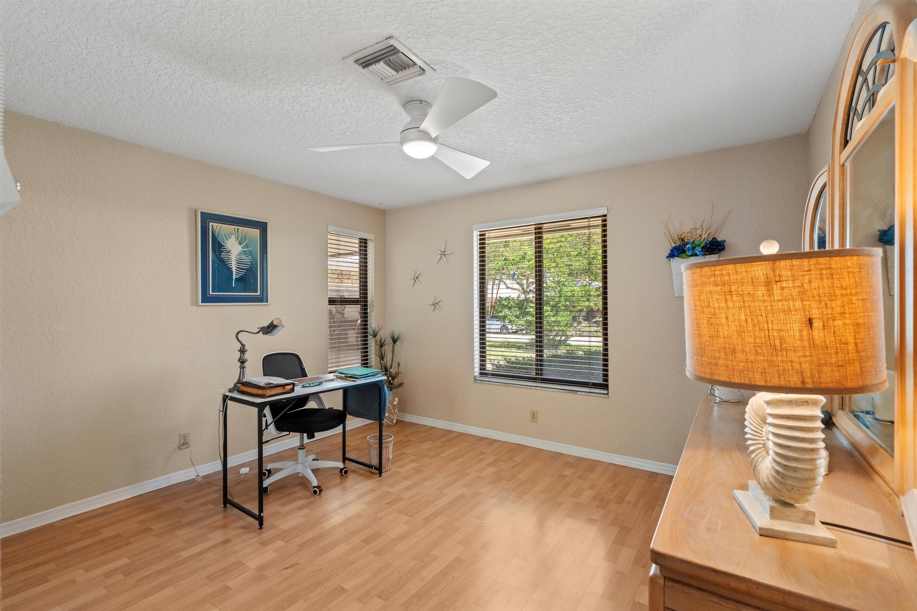 1223 Pepperridge Terrace Boca Raton, FL 33486 - Photo 23 of 34 a workspace with wooden floor and a window