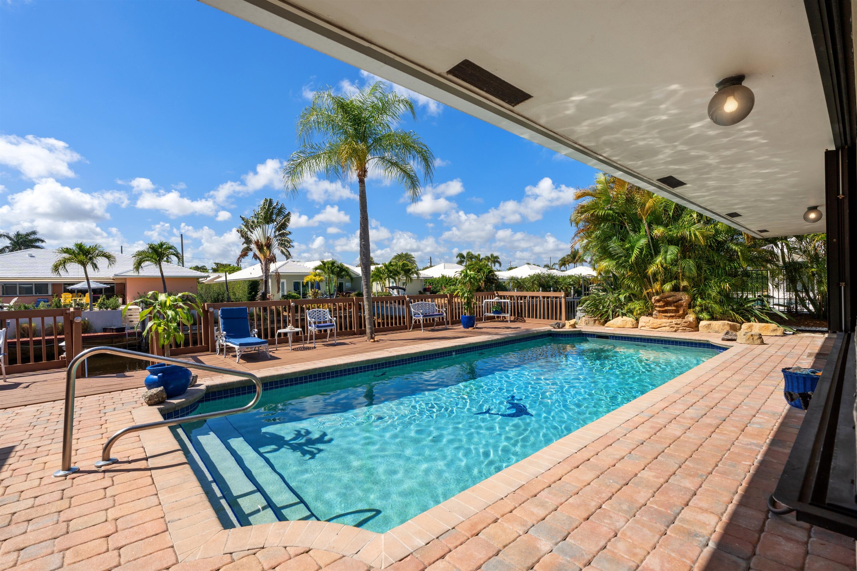1223 Pepperridge Terrace Boca Raton, FL 33486 - Photo 27 of 34 a view of swimming pool with outdoor seating