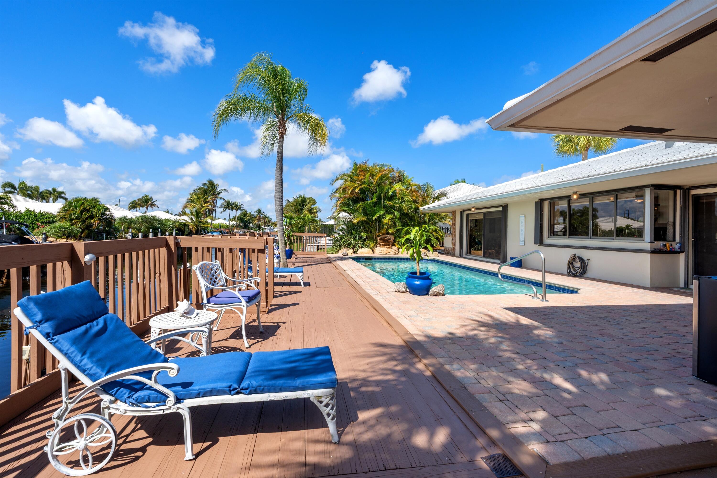 1223 Pepperridge Terrace Boca Raton, FL 33486 - Photo 29 of 34 a view of a patio with a table and chairs