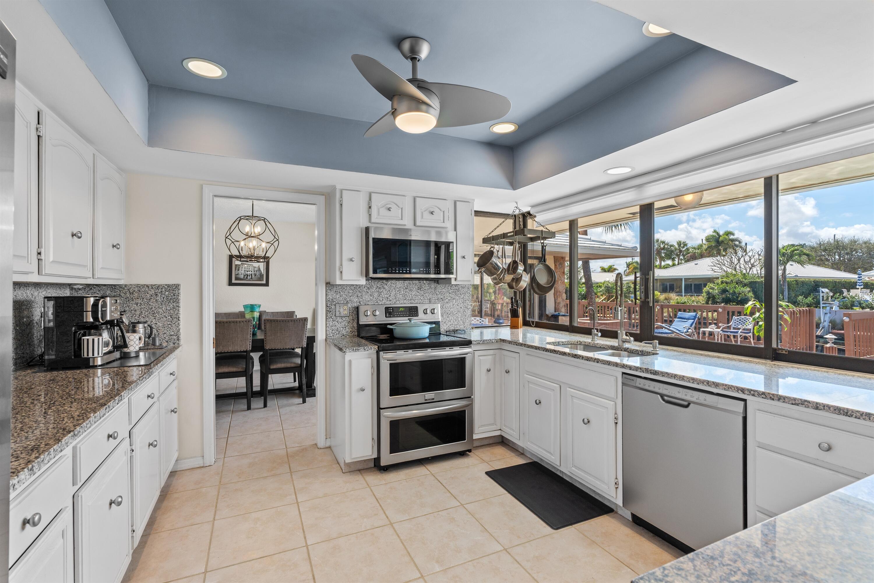 1223 Pepperridge Terrace Boca Raton, FL 33486 - Photo 10 of 34 a large kitchen with cabinets