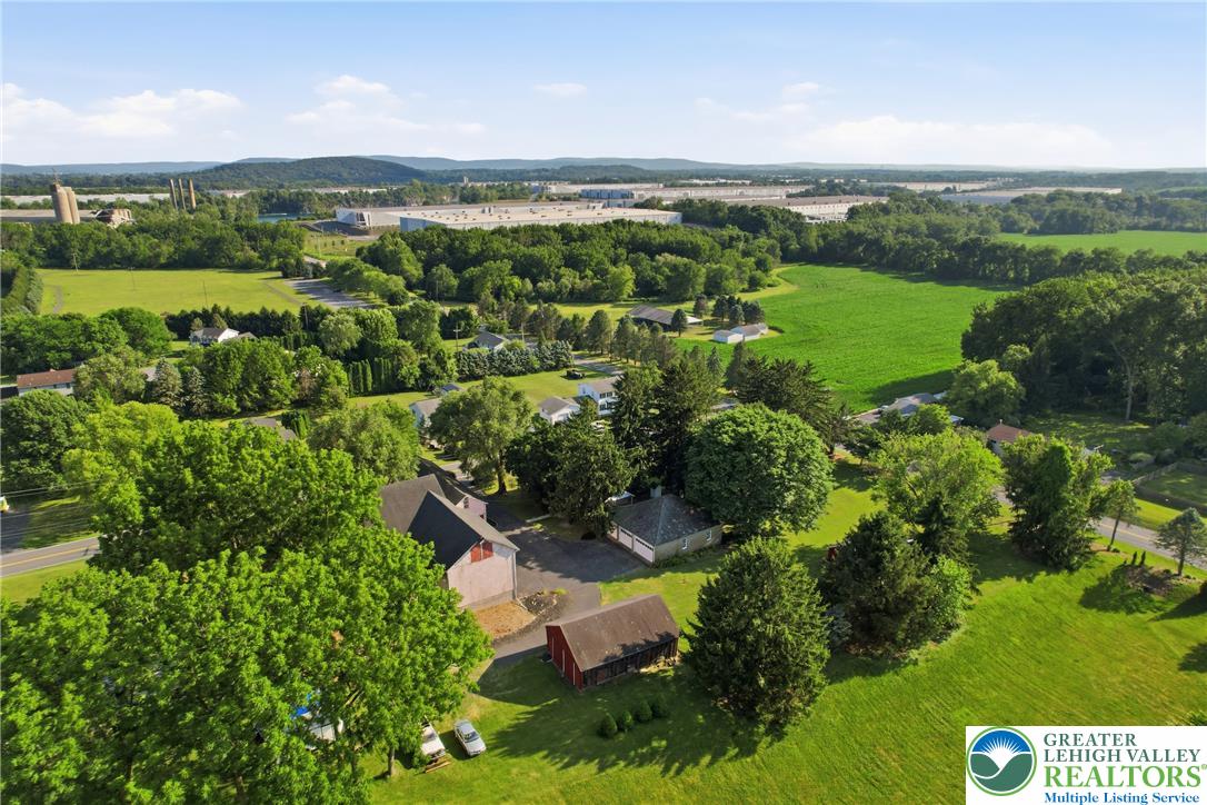 4682 Steuben Road Bethlehem, PA 18020 - Photo 74 of 79 An aerial panorama reveals a vast rural landscape with residential pockets, green fields, and distant mountains.