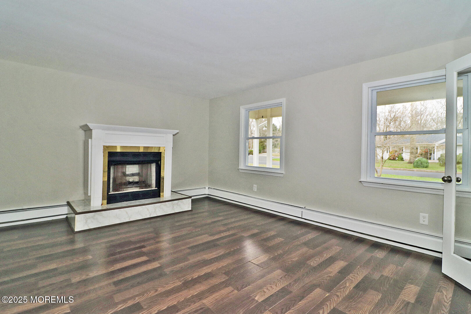 472 Steuben Avenue Forked River, NJ 08731 - Photo 17 of 50 a view of an empty room with wooden floor and a window