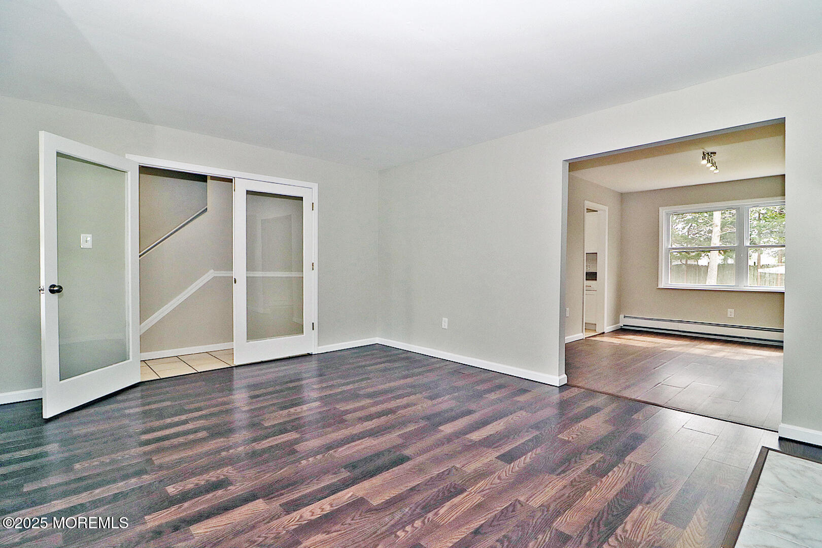 472 Steuben Avenue Forked River, NJ 08731 - Photo 19 of 50 an empty room with wooden floor and windows