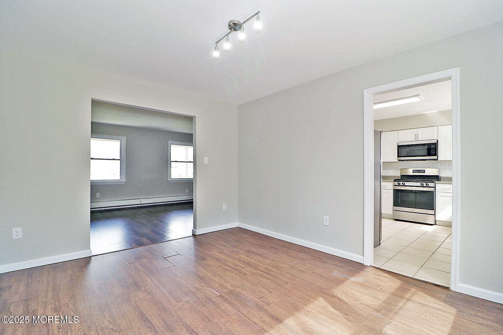 472 Steuben Avenue Forked River, NJ 08731 - Photo 22 of 50 wooden floor in an empty room with a window