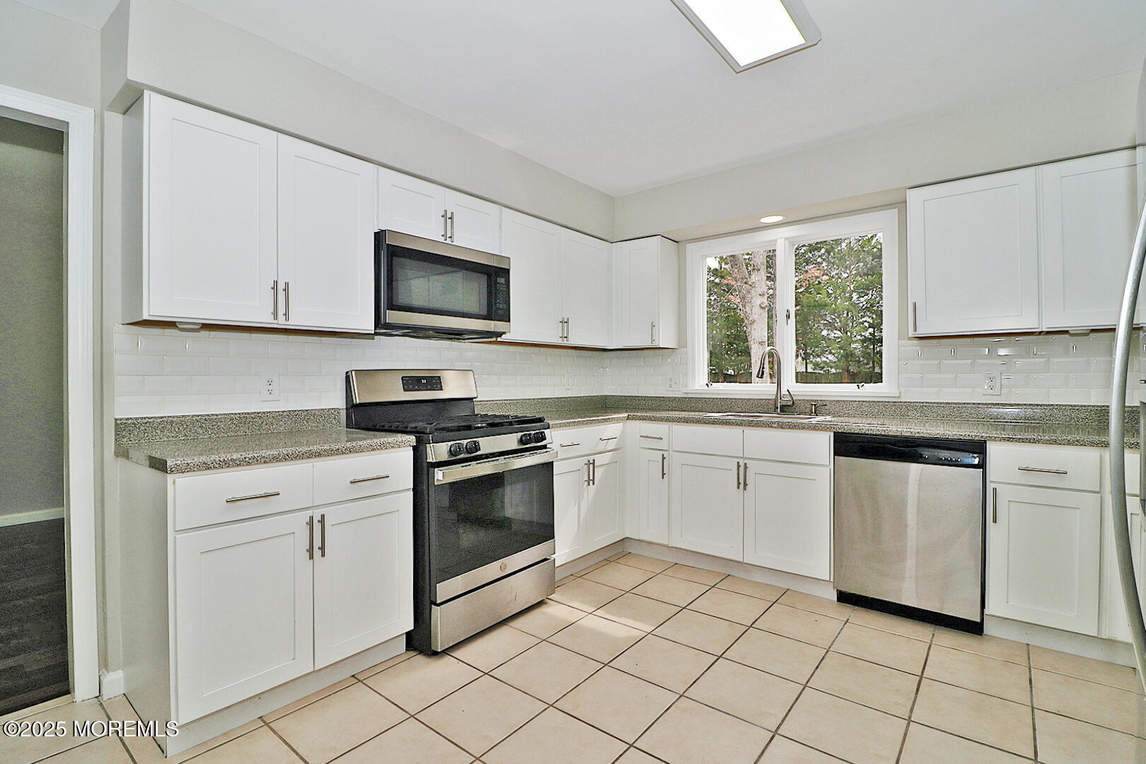 472 Steuben Avenue Forked River, NJ 08731 - Photo 26 of 50 a kitchen with granite countertop white cabinets white stainless steel appliances with a sink and dishwasher