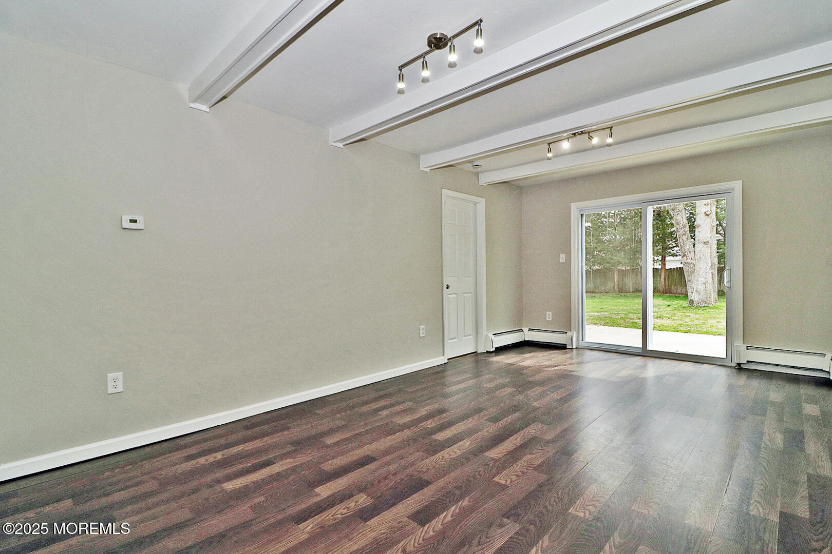 472 Steuben Avenue Forked River, NJ 08731 - Photo 29 of 50 a view of an empty room with wooden floor and a window