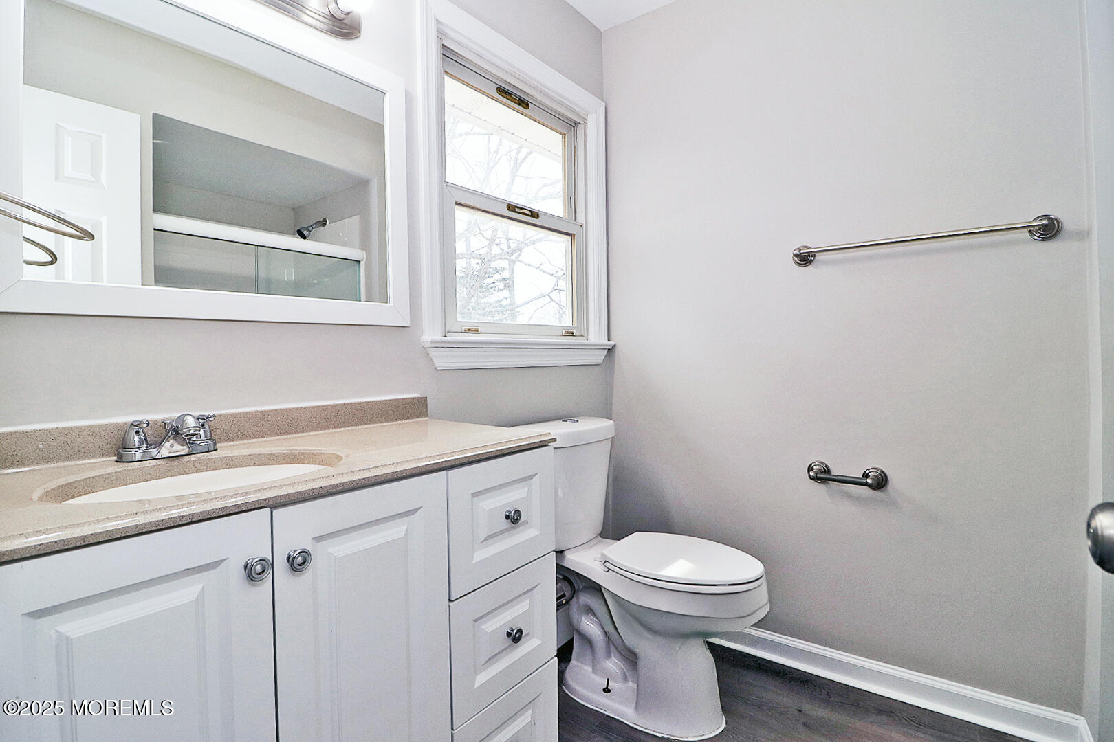 472 Steuben Avenue Forked River, NJ 08731 - Photo 40 of 50 a bathroom with a granite countertop toilet a sink a mirror and a window