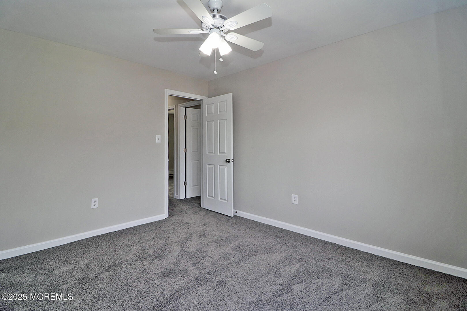 472 Steuben Avenue Forked River, NJ 08731 - Photo 50 of 50 an empty room with a fan & a ceiling fan